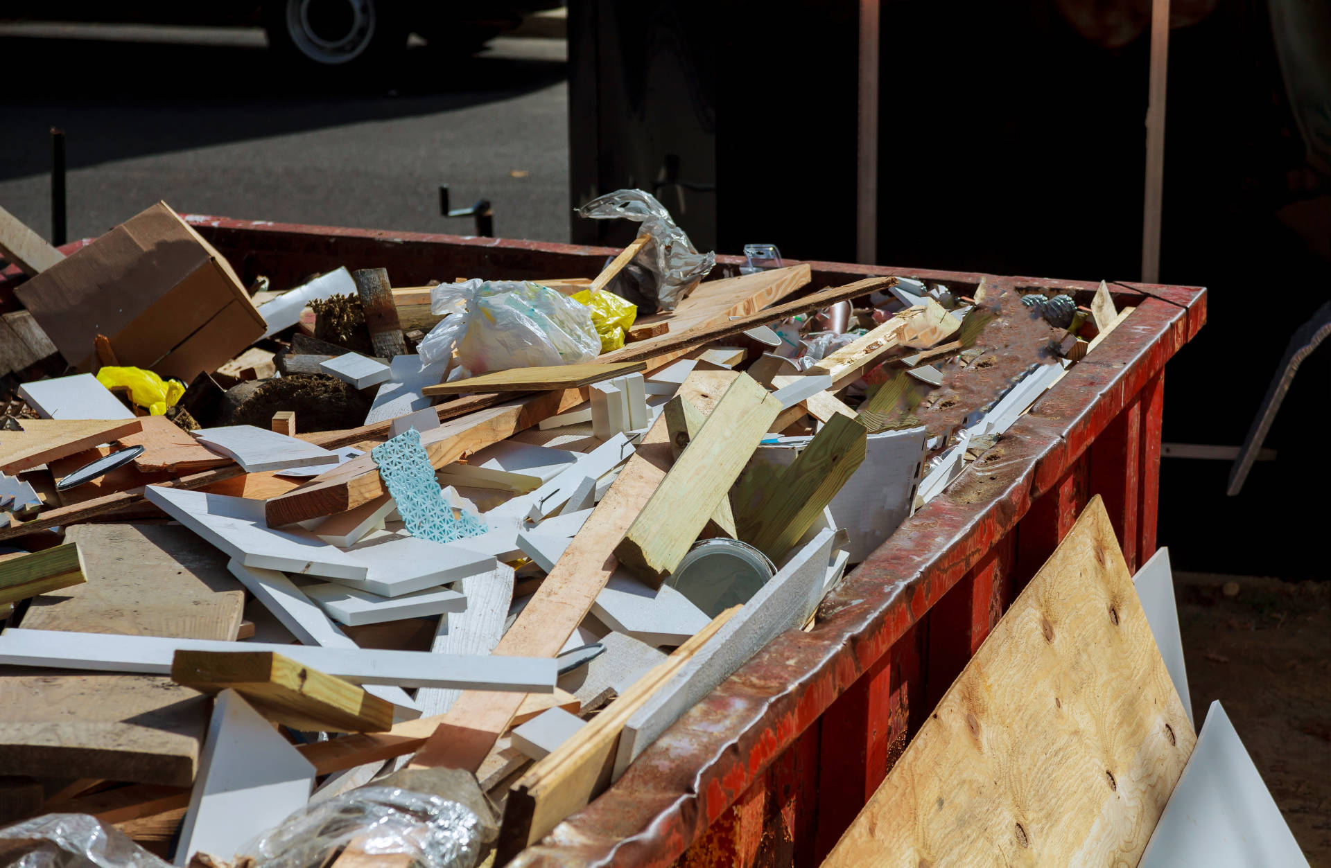 A dumpster full of renovation debris